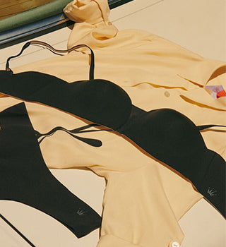 Black Flex Smart Lingerie Set lying flat with shirt on the floor